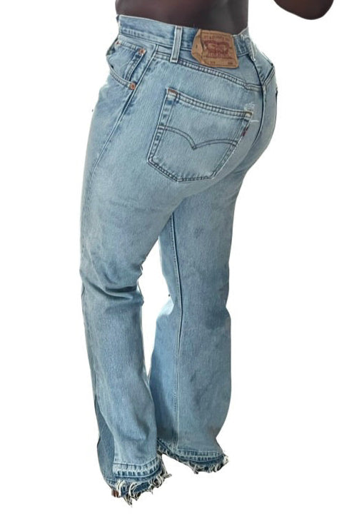 Light blue jeans with a brand logo on a white background