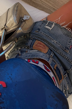 Person wearing blue jeans and beige shoes on a social media platform