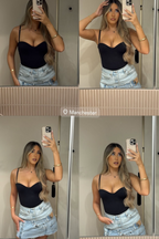 Person taking multiple mirror selfies wearing a black top and denim shorts.